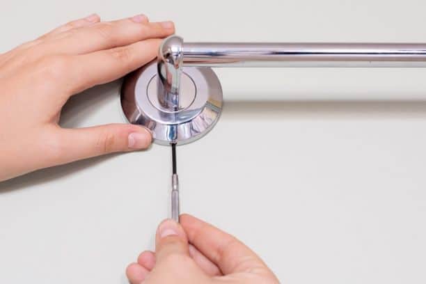 how to remove a towel bar with no visible screws